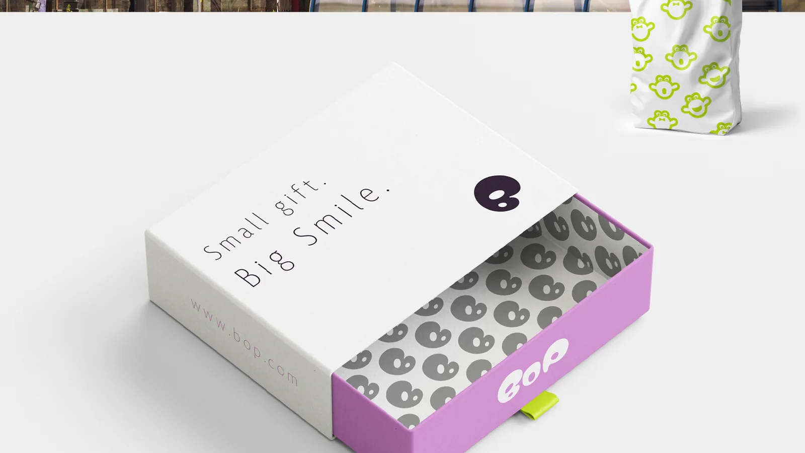 Gift box packaging: Small gift. Big Smile., with the pattern inside an orchid drawer.