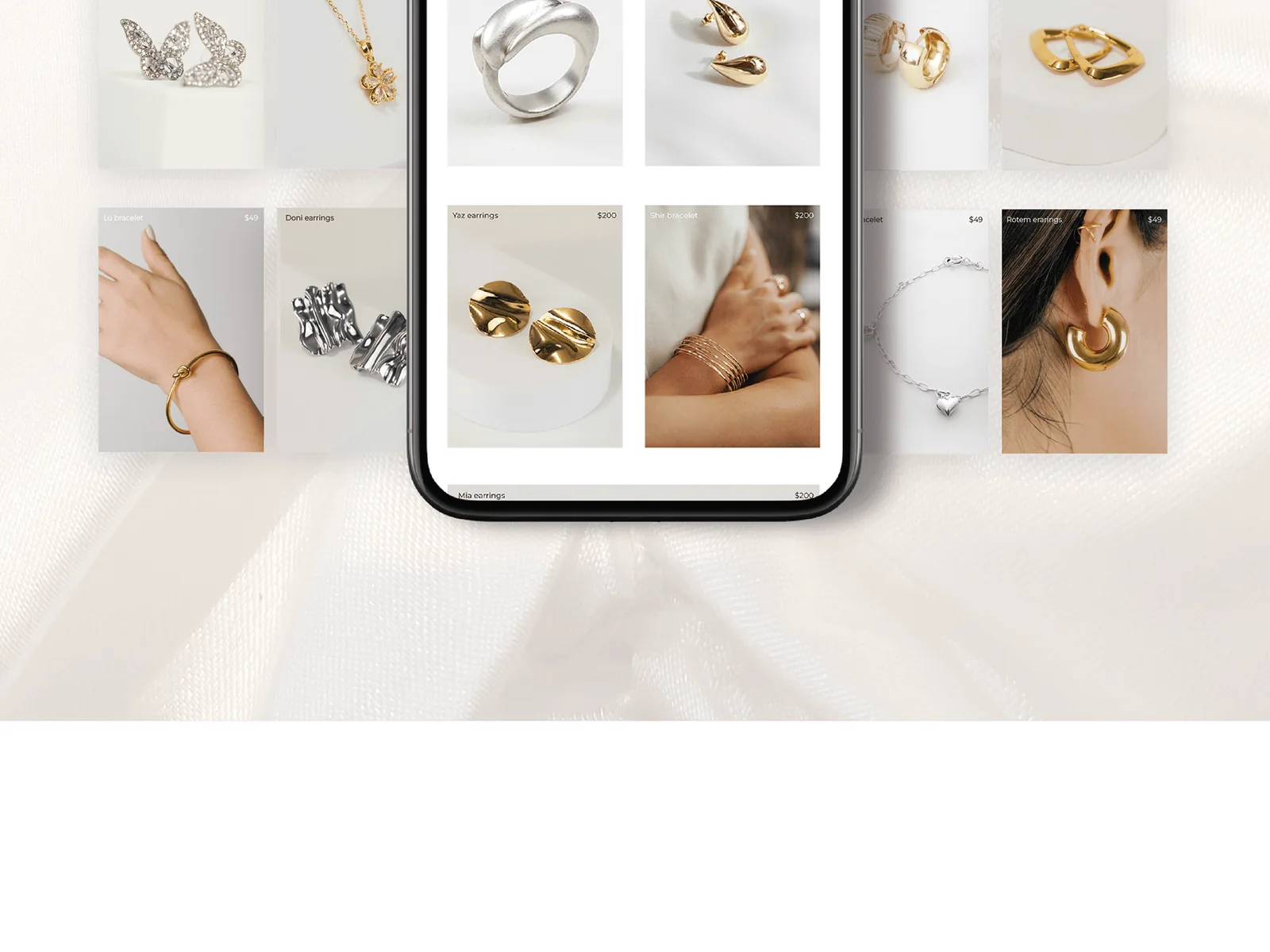 The jewelry product grid with earrings, rings, necklaces and bracelets.