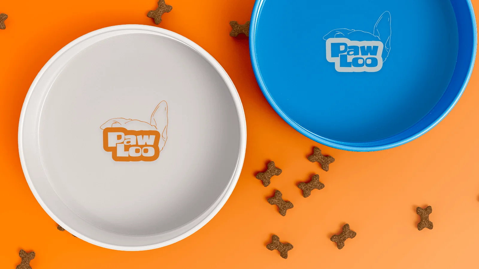 Grey and blue PawLoo food bowls on an orange background with treats.